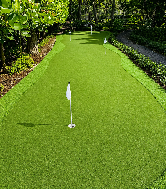 Putting Green Artificial Turf South Florida Putting green artificial turf installation in South Florida backyard with smooth golf surface realistic ball roll and custom design.